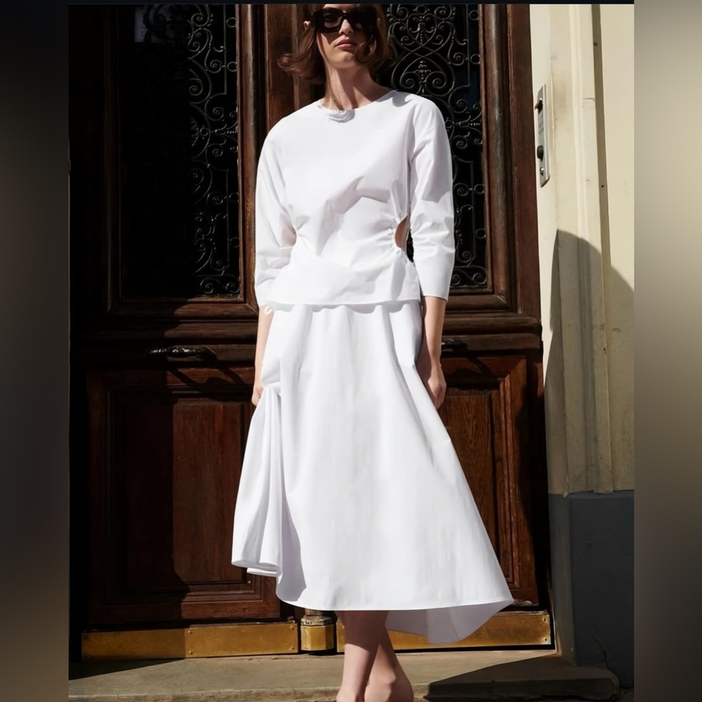 Zara White Blouse with cut out sides .